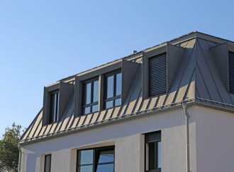 The Lifetime Exterior Upgrade: How Standing Seam Metal Roofs and Vinyl Frame Windows Eliminate Maintenance for Good